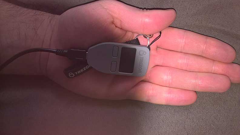 Trezor in the palm of a hand