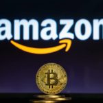 Amazon logo with a stack of physical Bitcoin in front of it.