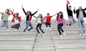 High school students jumping on stairs