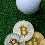 Golf ball on the fairway with bitcoin coins