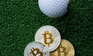 Golf ball on the fairway with bitcoin coins